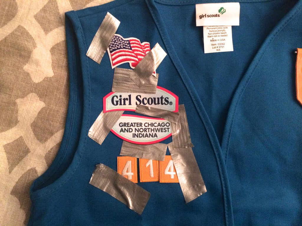 I don't know WTF everyone's talking about. I didn't have any problem putting the Girl Scouts badges on her vest.