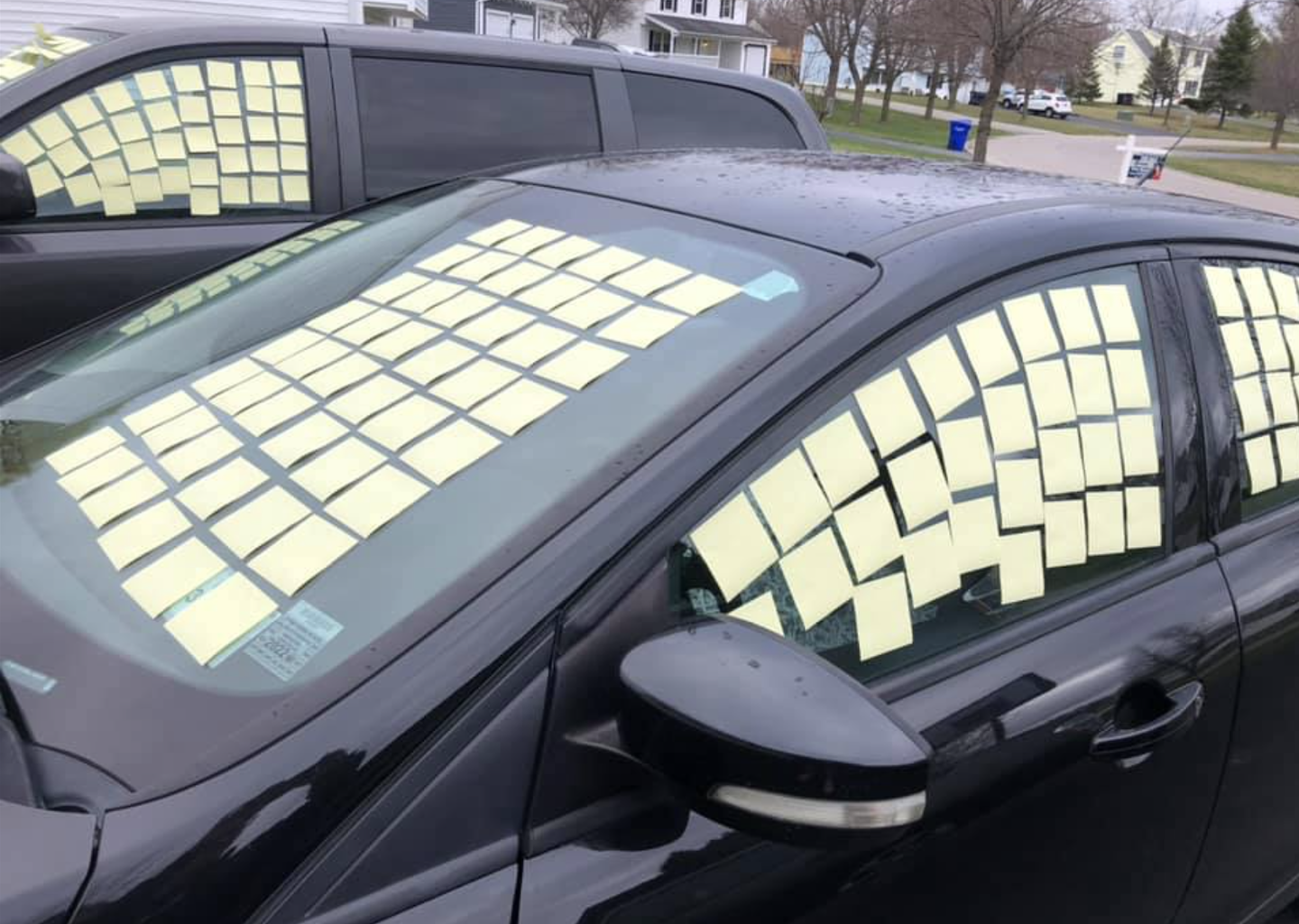 Car plastered with post-it notes April Fools Day prank